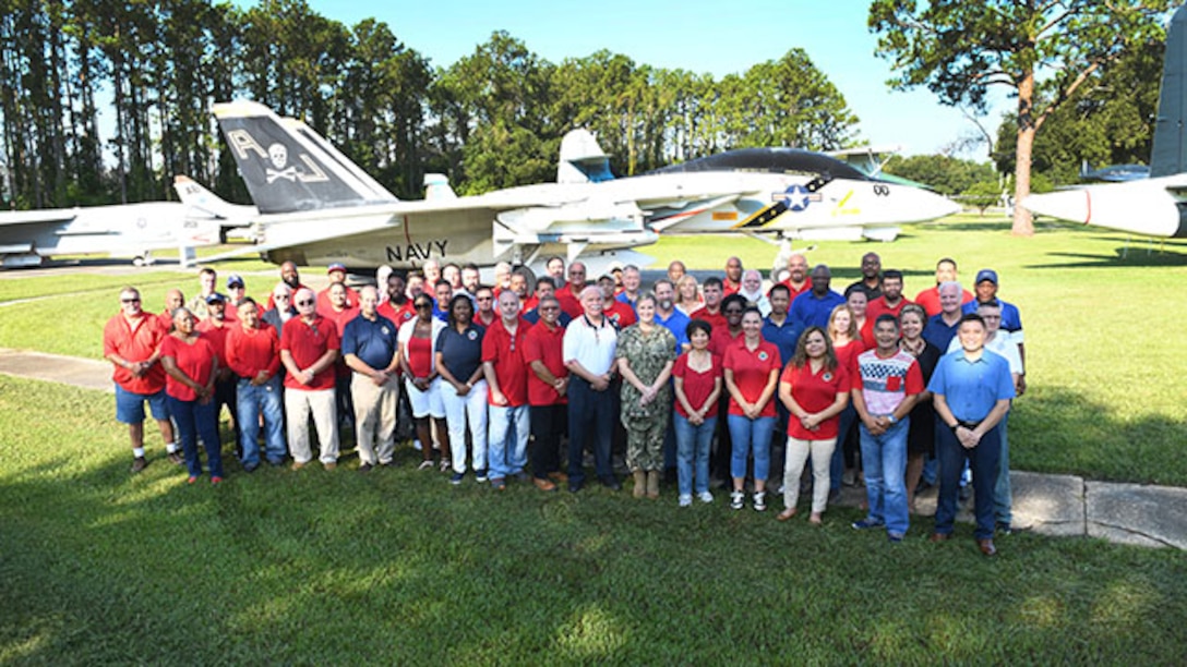DLA Aviation employees in Jacksonville, Florida, pose for picture