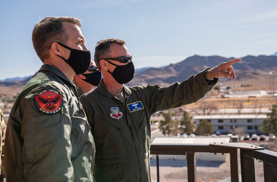 Col. Stephen Jones, left, 432nd Wing/432nd Air Expeditionary Wing commander, surveys the base from an air traffic control tower with Maj. Gen. Chad Franks, right, Fifteenth Air Force commander.