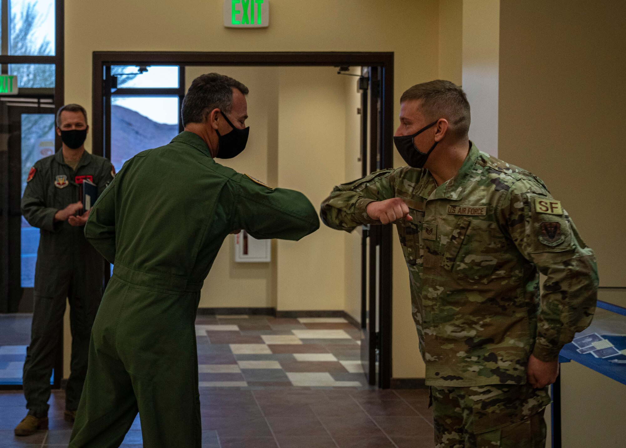 Maj. Gen. Chad Franks, Fifteenth Air Force commander, coins an Airman in the 432nd Wing/432nd Air Expeditionary Wing.