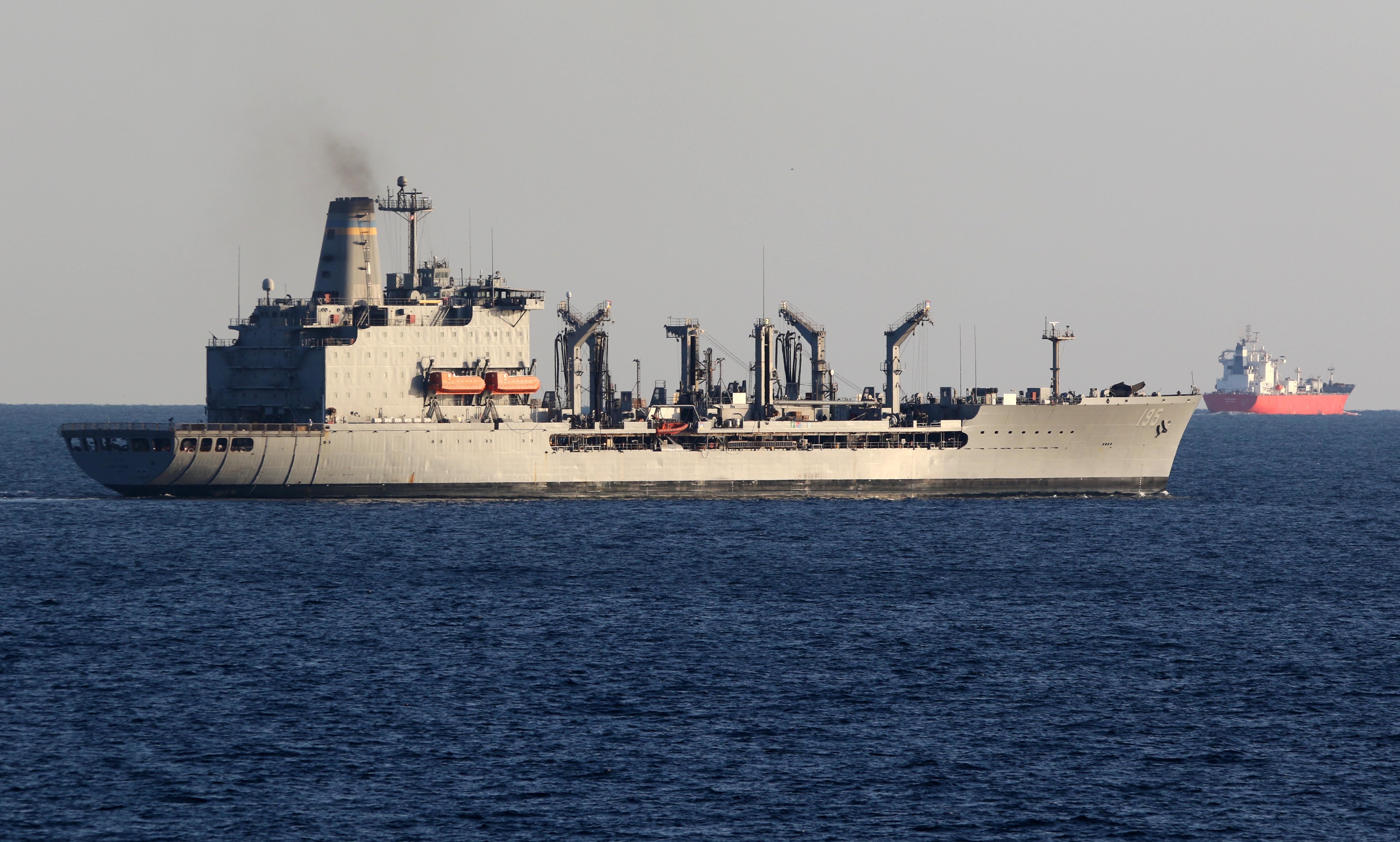 The Military Sealift Command fleet replenishment oiler USNS Leroy Grumman (T-AO 195) transits the Strait of Hormuz.