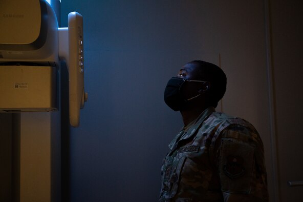 Chief Master Sgt. Brian Lewis, 47th Operations Group superintendent, studies an x-ray display screen at the x-ray laboratory on Laughlin Air Force Base, Texas, Jan. 8, 2021. Col. Craig Prather, 47th Flying Training Wing commander, and Chief Master Sgt. Lewis, visited the 47th Medical Group and spent time learning the different missions Airmen there have. (U.S. Air Force photo by Senior Airman Marco A. Gomez)
