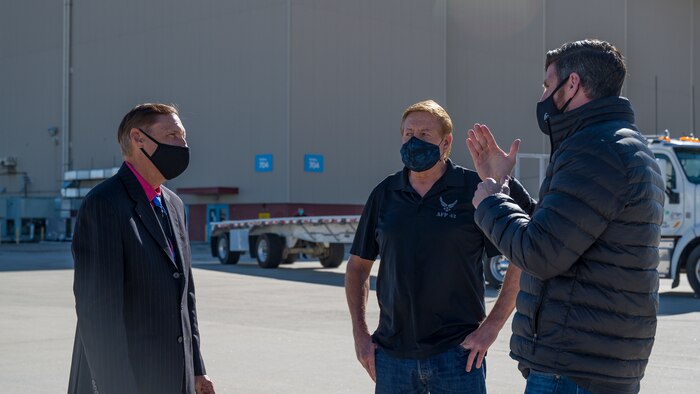 Dr. Roderick Davis, Air Force Plant 42 Deputy Director, and Ken Neitzel, Air Force Plant 42 Airfield Operations Director, talk with Edward Graham, Assistant to the Vice President of Programs and Government Relations for Samaritan’s Purse. (Air Force photo by Giancarlo Casem)