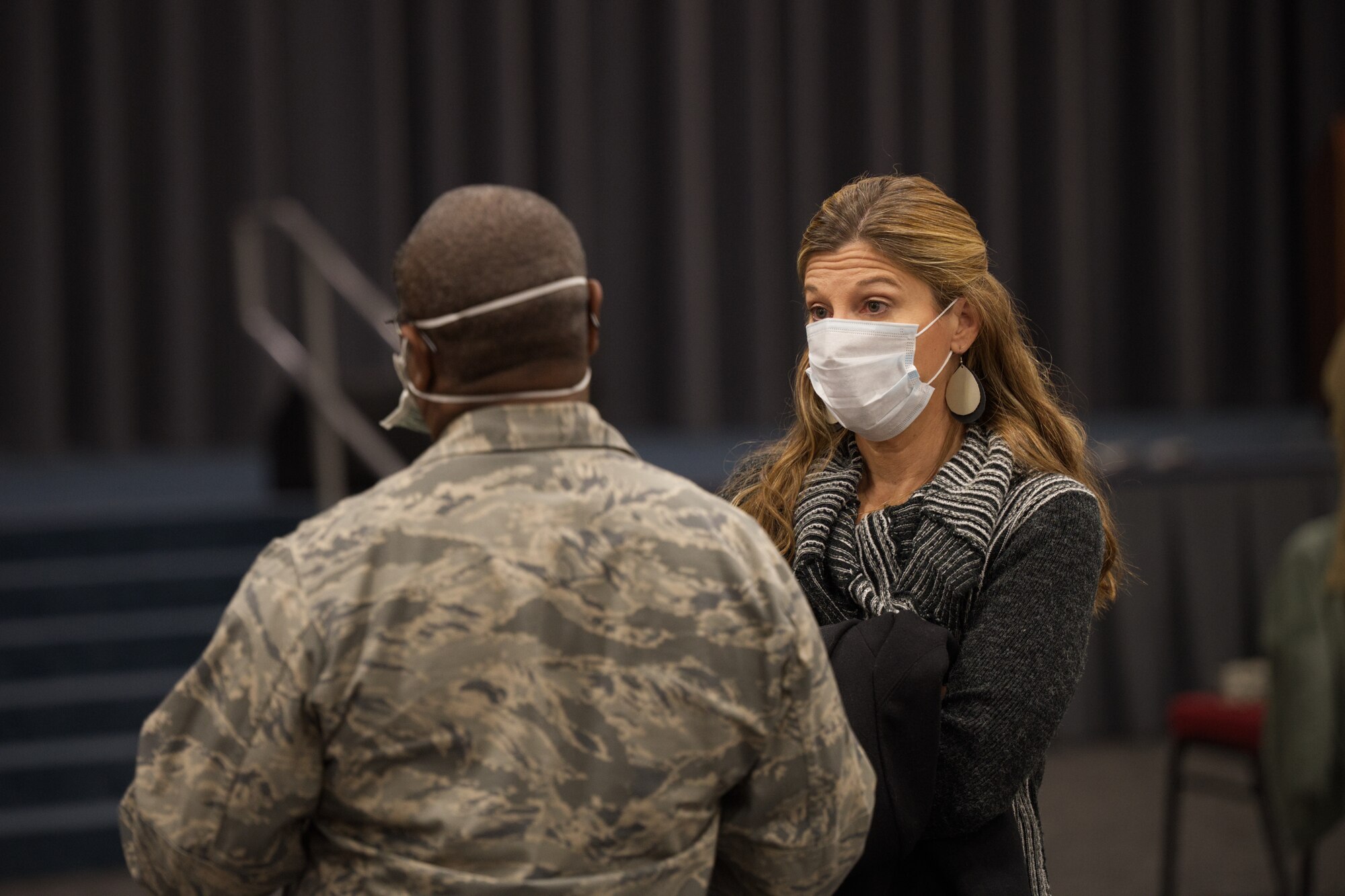 Photo of Airman speaking with civilian doctor