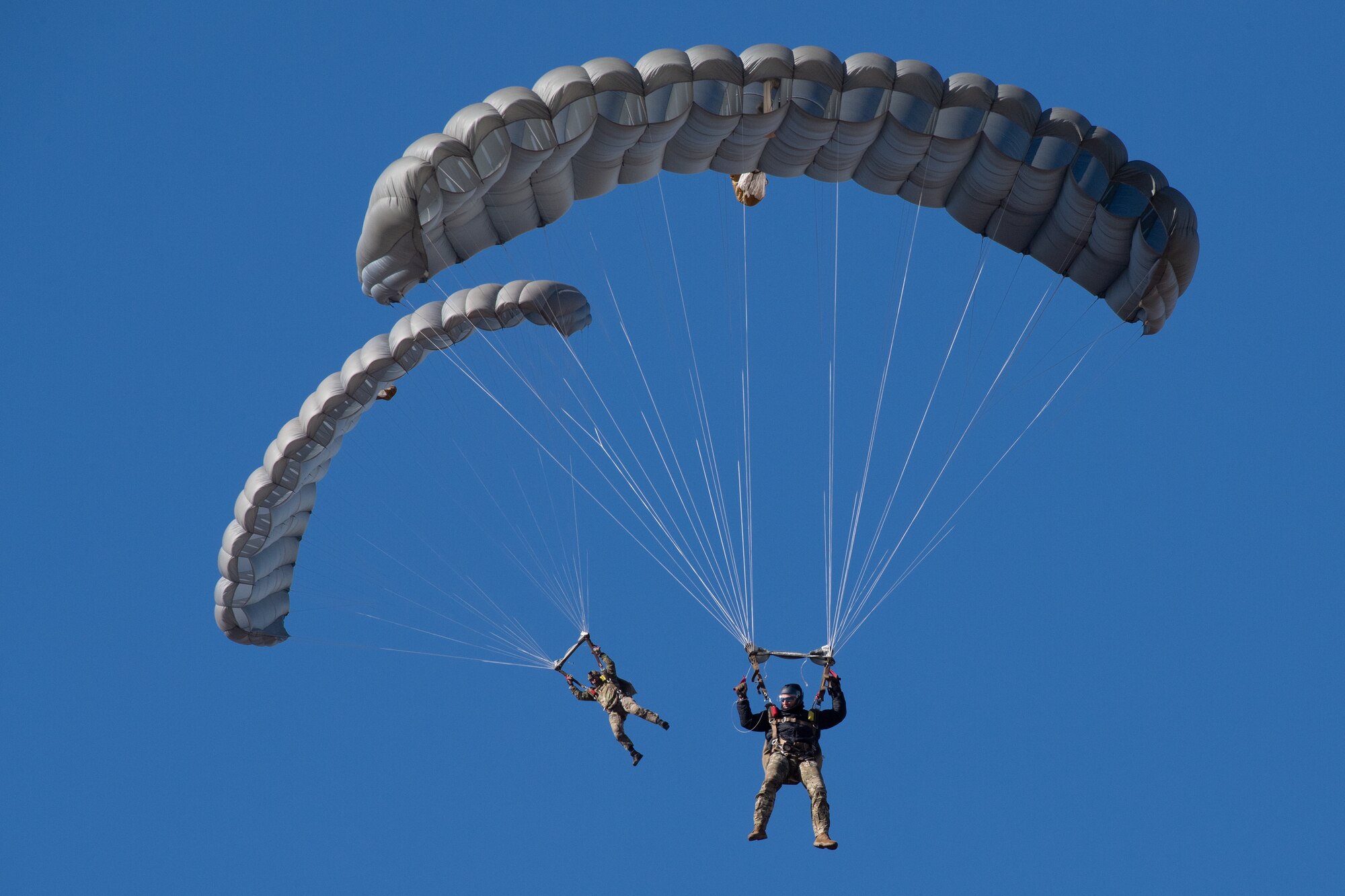 Two soldiers parachuting
