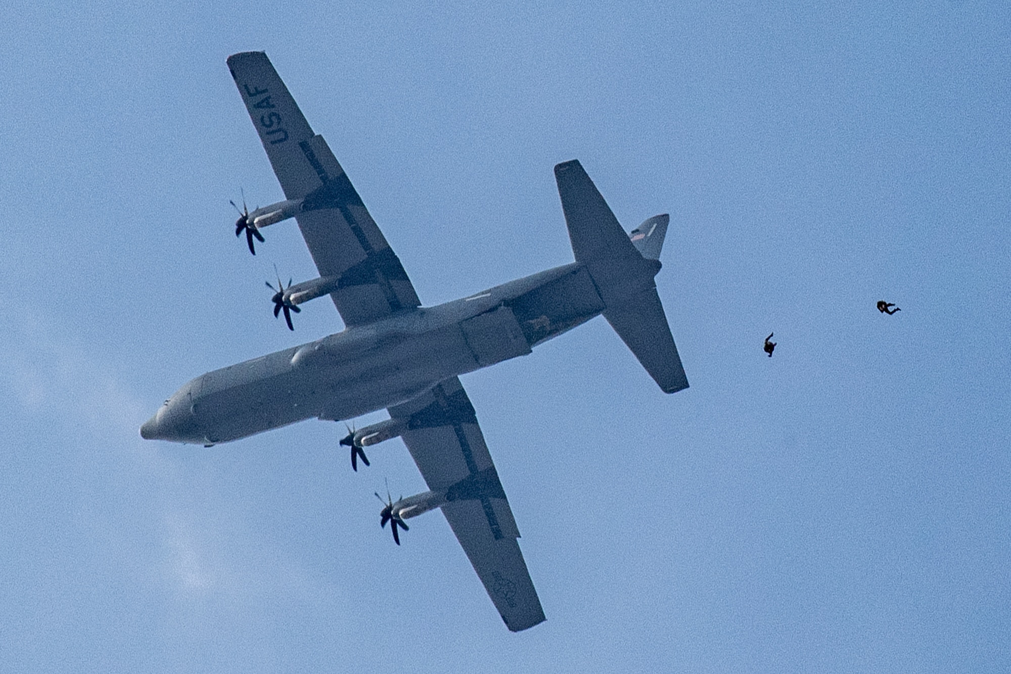 Airmen and Soldiers jump from C-130J Super Hercules