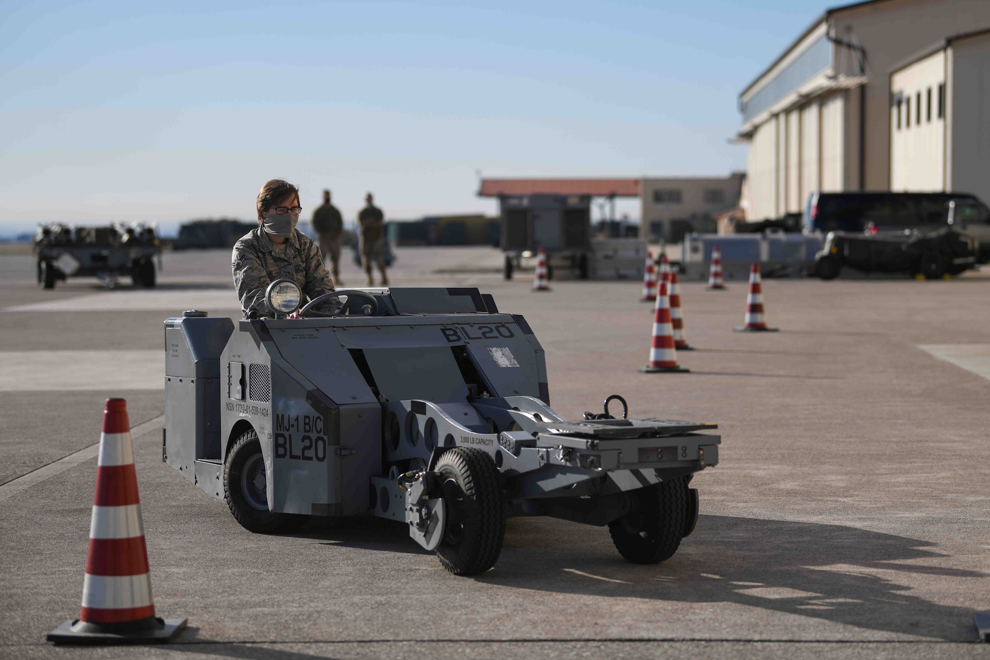 Airman 1st Class Sarah C. Wilson, 31st
Communication Squadron cybersecurity
technician, drives an MJ-1 bomb lift truck at
Aviano Air Base, Jan. 8, 2021. Wilson
participated in the first integrated Air Force
specialty code loading day event, where she
gained first-hand experience on being a
weapons troop. Wilson participated in a MJ-1
driving competition, where she had to precisely
drive through the course without hitting the
cones. (U.S. Air Force photo by Senior Airman
Ericka A. Woolever)
