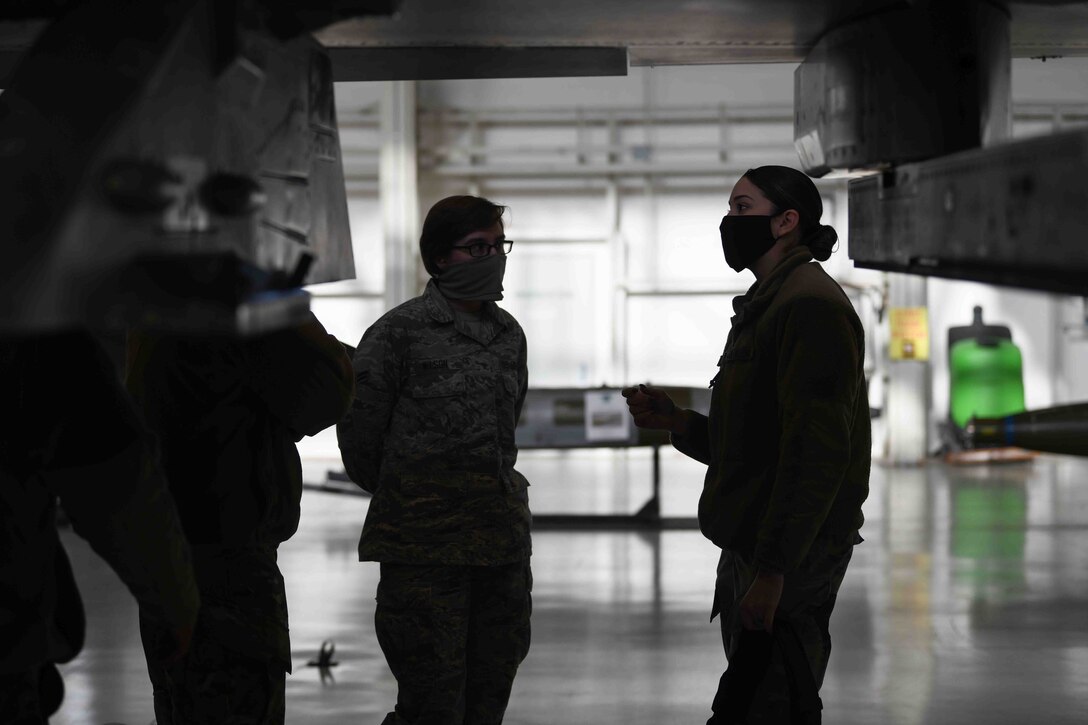 Senior Airman Destiny M. Furchak, 31st
Maintenance Group, weapons standardization
flight, squadron lead crew member, right,
briefed Airman 1st Class Sarah C. Wilson, 31st
Communication Squadron cybersecurity
technician, left, at Aviano Air Base, Jan. 8,
2021. Wilson participated in the first integrated
Air Force specialty code loading day event,
where she gained first-hand experience on
being a weapons troop. Wilson learned how to load
different munitions onto a U.S. Air Force F-16
Fighting Falcon. (U.S. Air Force photo by
Senior Airman Ericka A. Woolever)