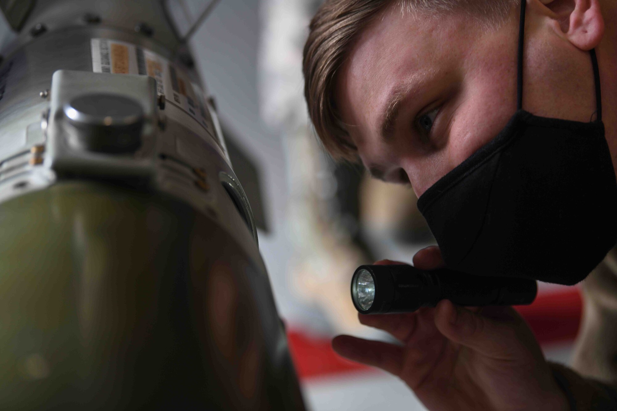 U.S. Air Force Staff Sgt. Cory J. Schultz, 31st
Communication Squadron surety systems
technician, inspects the fuse of a GBU-38 Joint
Direct Attack Munition at Aviano Air Base,
Jan. 8, 2021. Schultz participated in the first
integrated Air Force specialty code loading day
event at Aviano. He was part of a crew load,
which consisted of two members from the 31st
CS and one member from the 31st Maintenance
Group weapons standardization flight. (U.S. Air
Force photo by Senior Airman Ericka A.
Woolever)