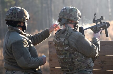 Virginia National Guard Soldiers assigned to the Virginia Beach-based 329th Regional Support Group conduct a familiarization live fire with the M320A1 grenade launcher Dec. 11, 2020, at Fort Pickett, Virginia.