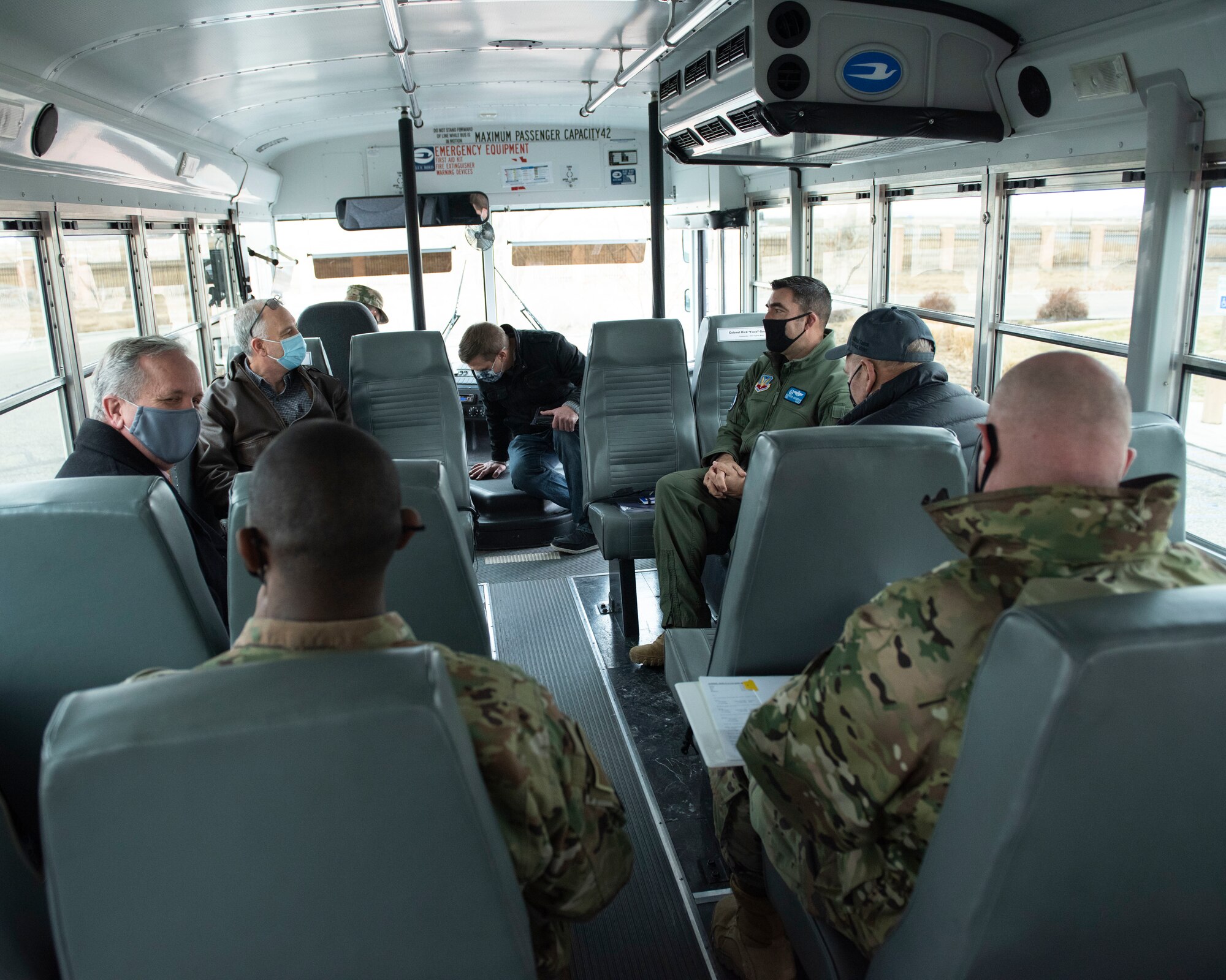 Idaho State Representatives and the 366th Fighter Wing leaders take a tour of the base inside a bus.