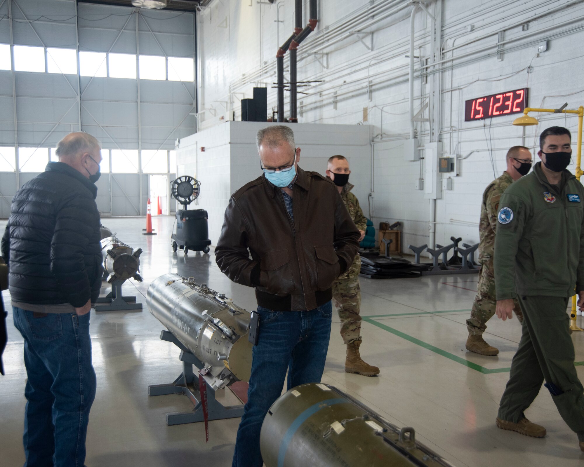 Idaho State Representatives looks at a cluster bomb unit.