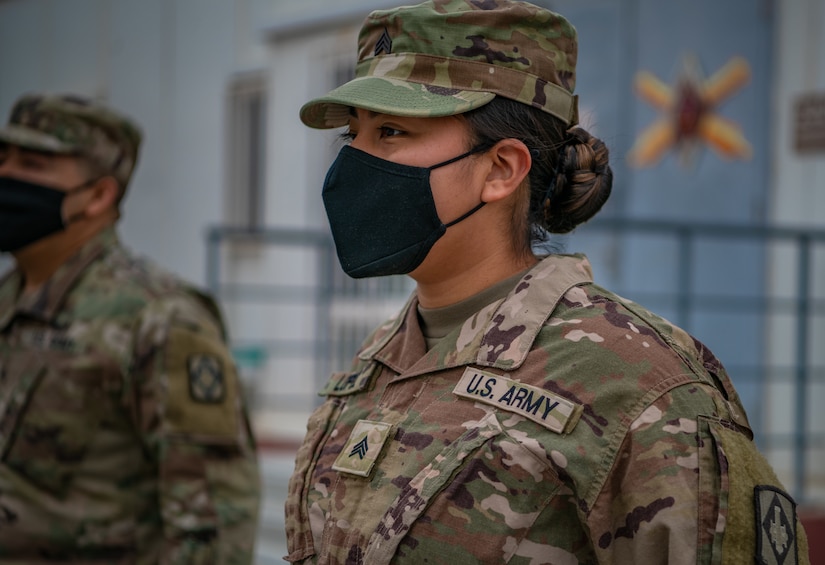 Sgt. Brandy Lopez, an Information Technology (IT) Specialist assigned to 75th Field Artillery Brigade, stands at the position of attention after being promoted to the rank of sergeant while deployed to the Middle East on December 28, 2020. For the past nine months, Lopez had provided countless hours of IT support and troubleshooting to every Diamond Brigade Soldier deployed to the Middle East and was selected as the only Specialist to be promoted through Battle Field Promotion within Area Support Group - Jordan. (U.S. Army photo by Sgt. Dustin D. Biven / 75th Field Artillery Brigade)