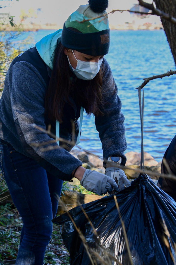 PORTSMOUTH, Va. (Jan. 9, 2020) Clarice Lorenzini, Substance Abuse Rehabilitation Program (SARP) recreation therapist, alongside her patients, collect trash along the shoreline behind the base gym.