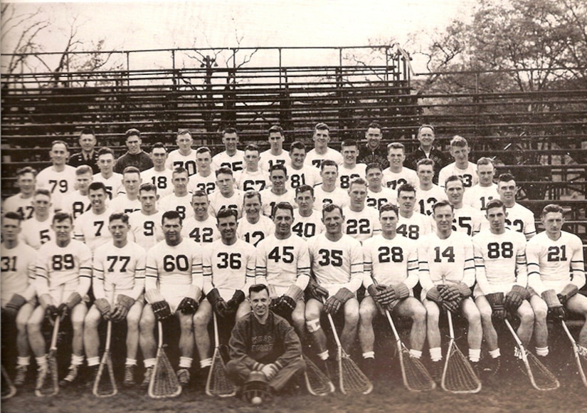 Lacrosse players pose for a team photo.