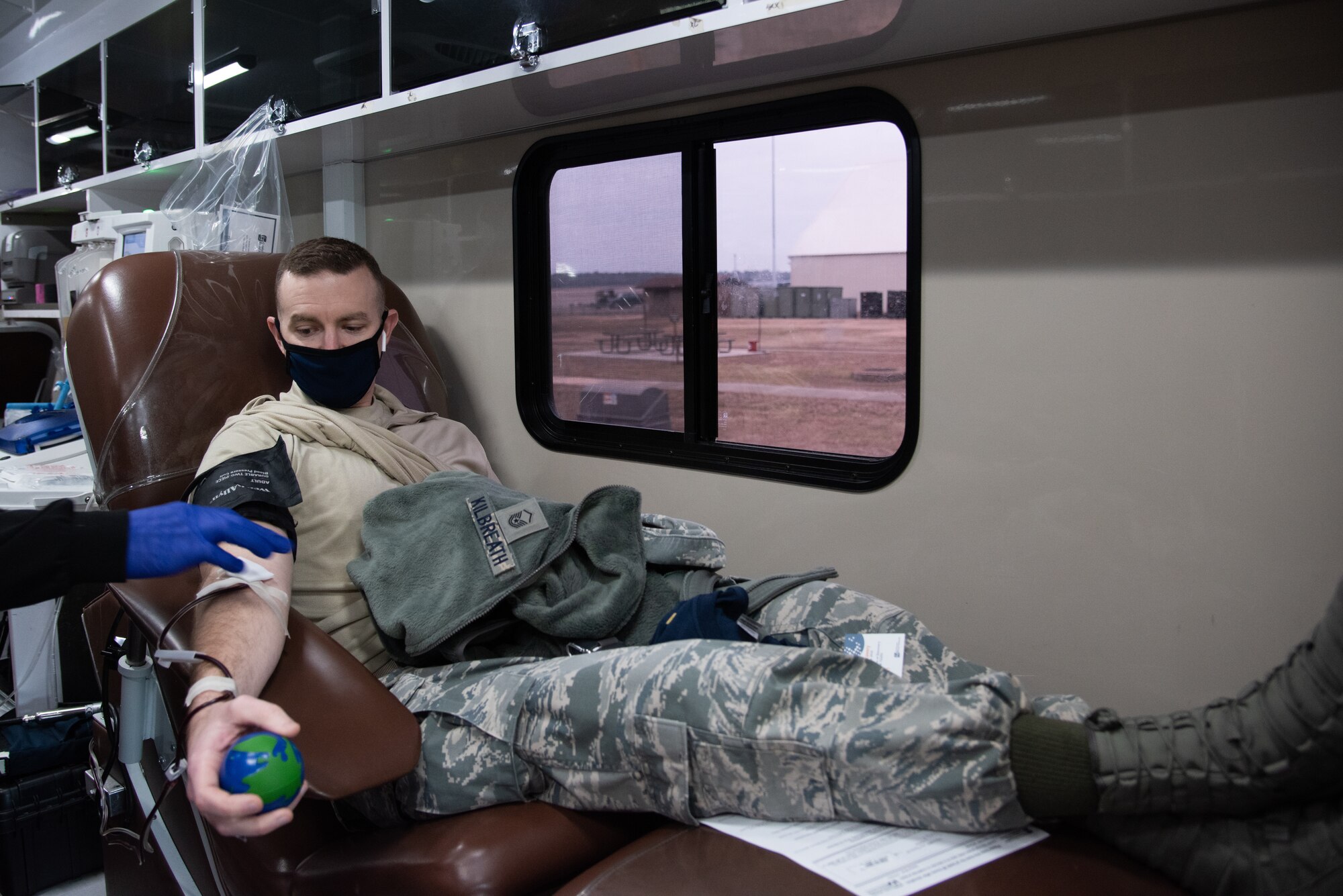 Air Force Reserve Master Sgt. Matthew Kilbreath, 913th Airlift Group Wing Inspection Team manager, donates blood for Arkansas Blood Institute on Little Rock Air Force Base, Ark., Jan. 10, 2021. The donations directly benefit former Senior Airman John May, who is battling a rare cancer, by providing credits that help cover some of his medical expenses. (Air Force Reserve photo by Airman 1st Class Kalee Sexton)