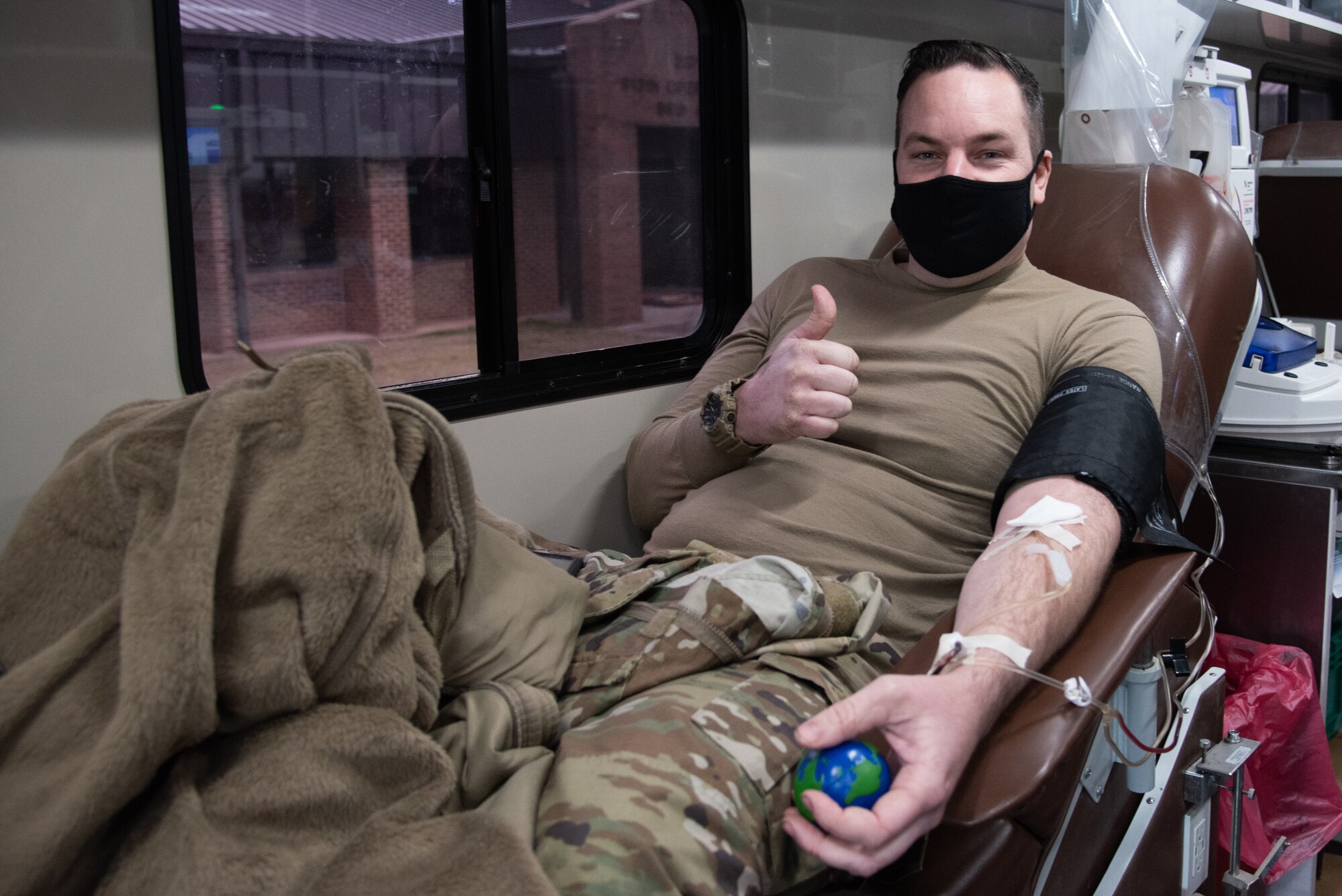 Air Force Reserve Tech. Sgt. Karl Sager, 96th Aerial Port Squadron, gives a thumbs up whole donating blood during a blood drive on Little Rock Air Force Base, Ark., Jan. 10, 2021. Arkansas Blood Institute holds drives on base throughout the year as part of a partnership with the 913th Airlift Group. (Air Force Reserve photo by Airman 1st Class Kalee Sexton)