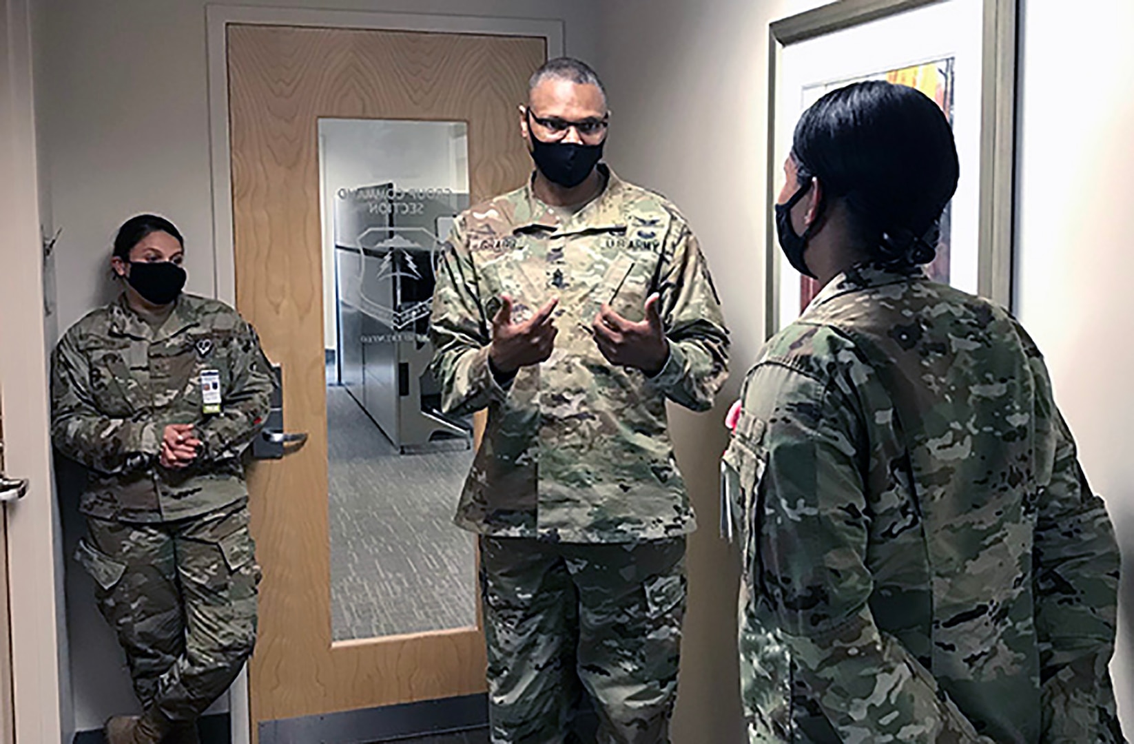 Army Command Sgt. Maj. Michael Gragg (center), senior enlisted leader at the Defense Health Agency, mentors airmen at Joint Base Langley-Eustis in Hampton, Virginia, Sept. 23, 2020.