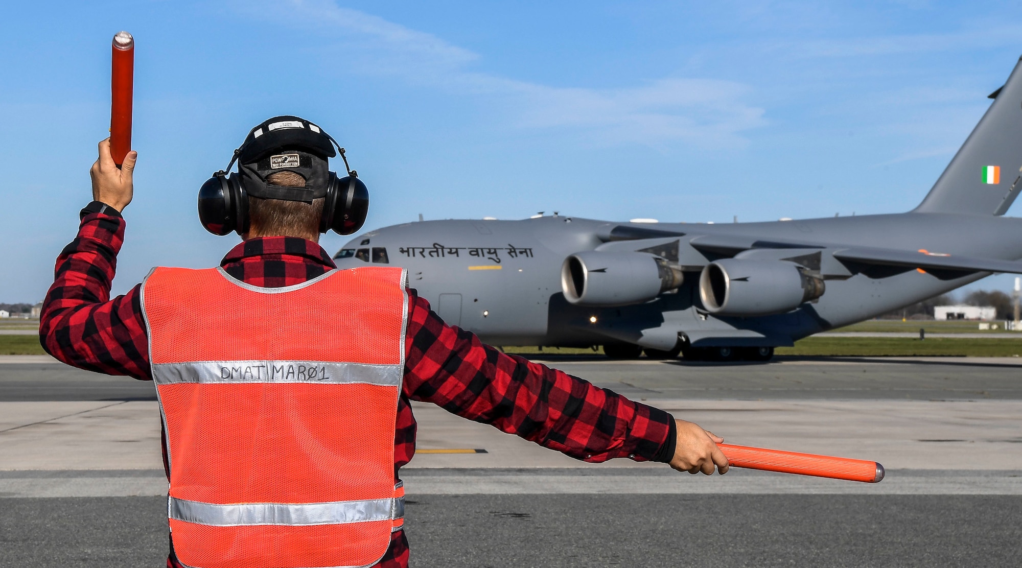 A member of the 436th Aircraft Maintenance Squadron transient alert marshals an Indian air force C-17 Globemaster III Nov. 20, 2020, at Dover Air Force Base, Delaware. Dover AFB annually supports $3.5 billion worth of FMS operations due to its strategic location and 436th Aerial Port Squadron, the largest aerial port in the Department of Defense. The United States and India have shared interests in promoting global security, stability and economic prosperity. (U.S. Air Force photo by Senior Airman Christopher Quail)