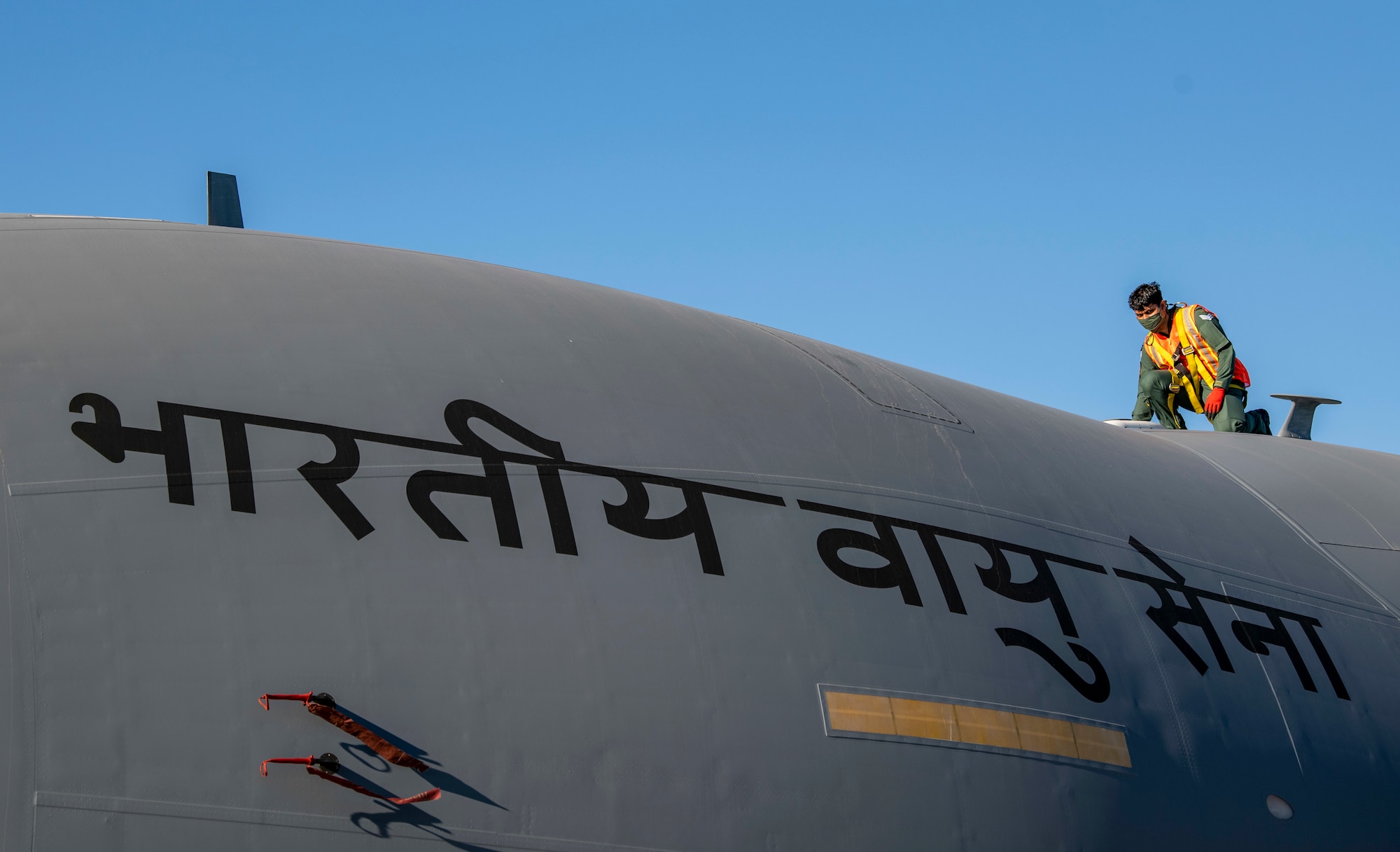 A member of the Indian air force 28th Wing inspects an Indian air force C-17 Globemaster III at Dover Air Force Base, Delaware, Nov. 20, 2020. Dover AFB annually supports $3.5 billion worth of FMS operations due to its strategic location and 436th Aerial Port Squadron, the largest aerial port in the Department of Defense. The United States and India have shared interests in promoting global security, stability and economic prosperity. (U.S. Air Force photo by Senior Airman Christopher Quail)