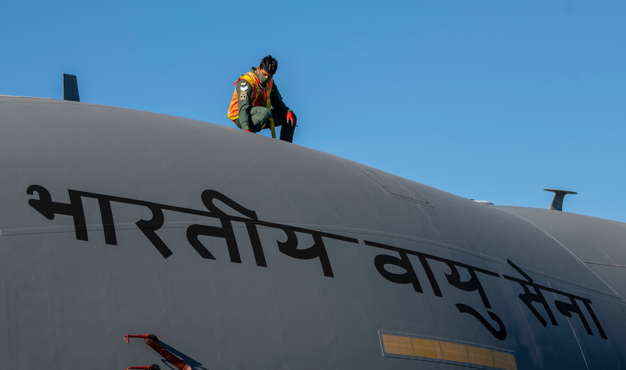 A member of the Indian air force 28th Wing inspects an Indian air force C-17 Globemaster III at Dover Air Force Base, Delaware, Nov. 20, 2020. Dover AFB annually supports $3.5 billion worth of FMS operations due to its strategic location and 436th Aerial Port Squadron, the largest aerial port in the Department of Defense. The United States and India have shared interests in promoting global security, stability and economic prosperity. (U.S. Air Force photo by Senior Airman Christopher Quail)