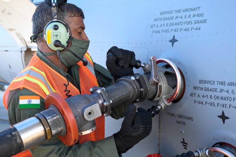 A member of the Indian air force 28th Wing attaches a fuel hose to an Indian air force C-17 Globemaster III at Dover Air Force Base, Delaware, Nov. 20, 2020. The U.S. strengthens its international partnerships through foreign military sales. Dover AFB actively supports $3.5 billion worth of FMS due to its strategic location and 436th Aerial Port Squadron, the largest aerial port in the Department of Defense. As the world’s oldest and largest democracies, the United States and India share a commitment to freedom, human rights and rule of law. (U.S. Air Force photo by Senior Airman Christopher Quail)