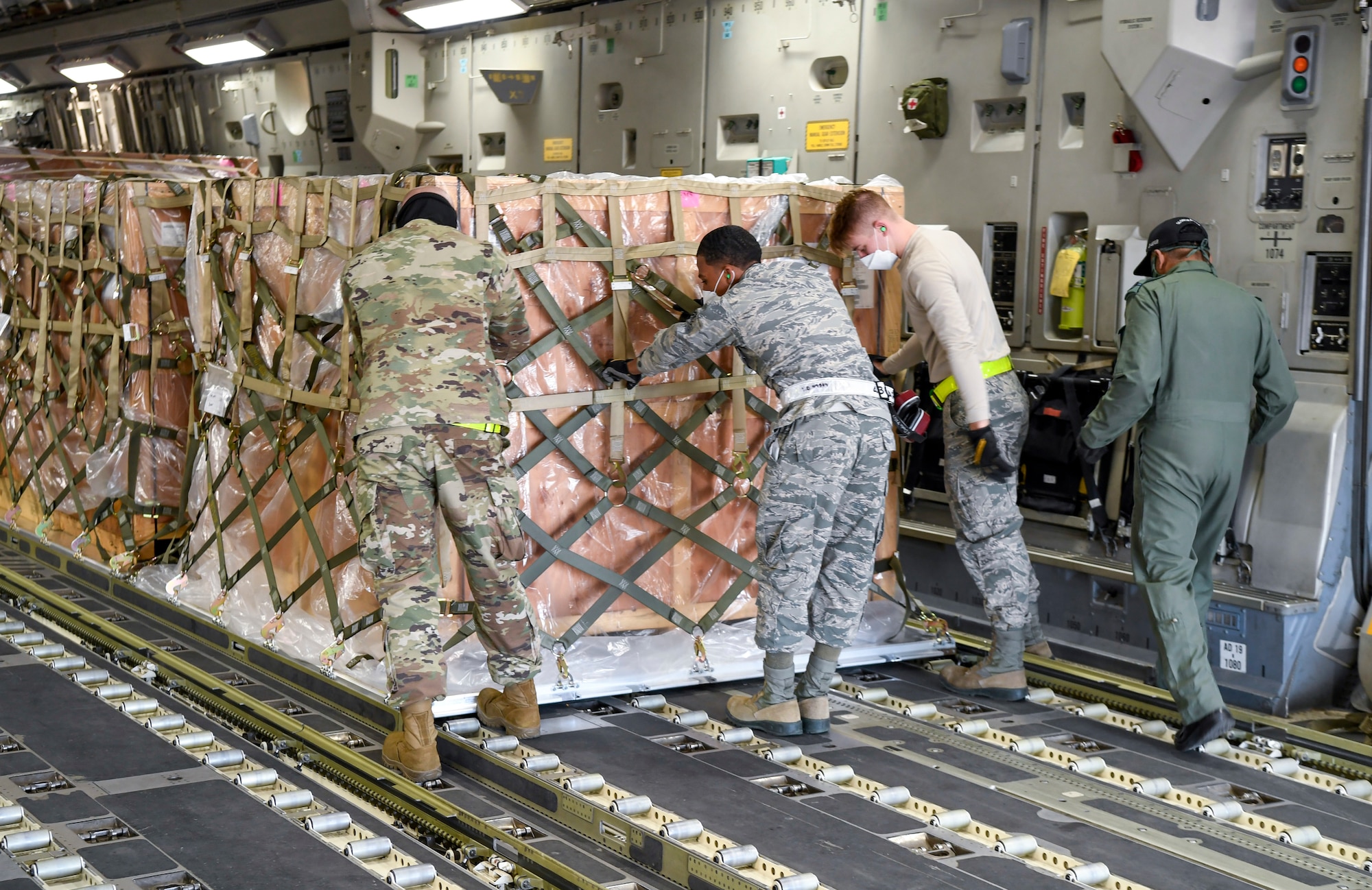 Airmen from the 436th Aerial Port Squadron move cargo onto an Indian air force C-17 Globemaster III at Dover Air Force Base, Delaware, Nov. 20, 2020. The U.S. strengthens its international partnerships through foreign military sales. Dover AFB actively supports $3.5 billion worth of FMS due to its strategic location and 436th Aerial Port Squadron, the largest aerial port in the Department of Defense. As the world’s oldest and largest democracies, the United States and India share a commitment to freedom, human rights and rule of law. (U.S. Air Force photo by Senior Airman Christopher Quail)