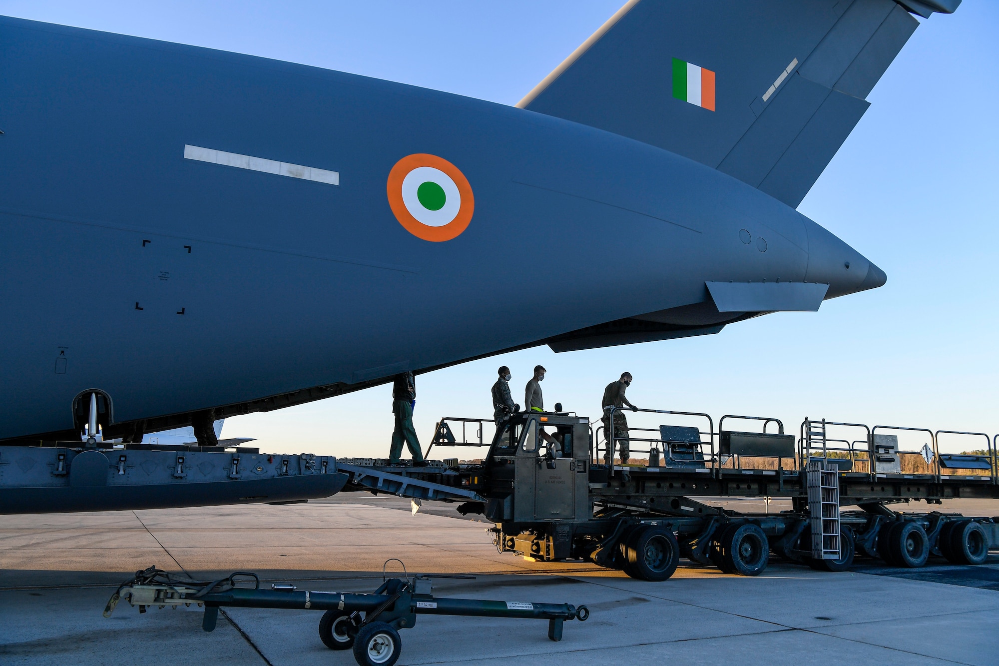 The sun sets on a Indian air force C-17 Globemaster III during an foreign military sales operation at Dover Air Force Base, Delaware, Nov. 20, 2020. The U.S. strengthens its international partnerships through foreign military sales. Dover AFB actively supports $3.5 billion worth of FMS due to its strategic location and 436th Aerial Port Squadron, the largest aerial port in the Department of Defense. As the world’s oldest and largest democracies, the United States and India share a commitment to freedom, human rights and rule of law. (U.S. Air Force photo by Senior Airman Christopher Quail)