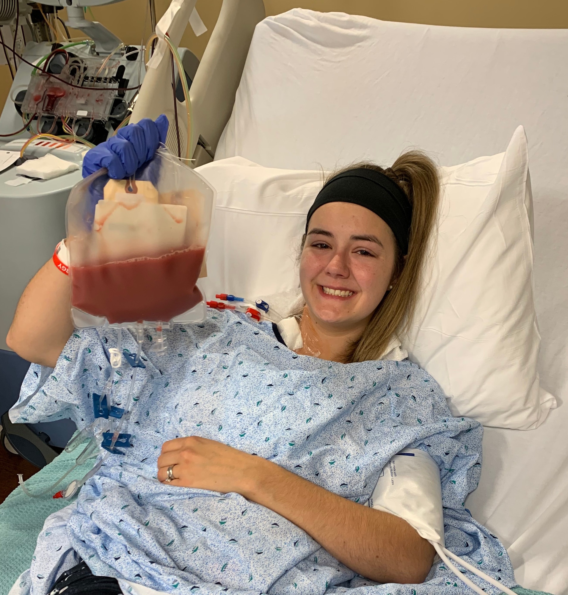 Image of a woman in a hospital bed.