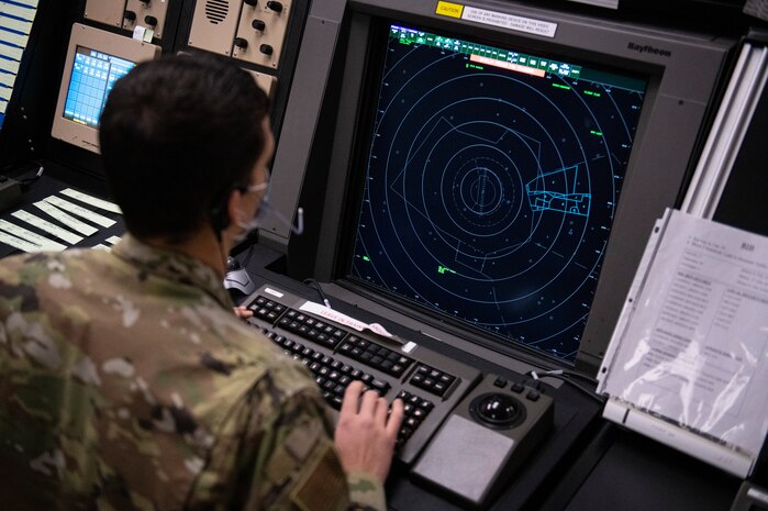 Airman 1st Class Ashtan Howell, 97th Operations Support Squadron Radar Approach Control (RAPCON) air traffic controller, views a screen at Altus Air Force Base, Oklahoma, Jan. 11, 2020. Before earning his job badge, Howell had to complete a four-month technical training course, followed by more than a year of training after arriving at Altus. (U.S. Air Force photo by Senior Airman Breanna Klemm)