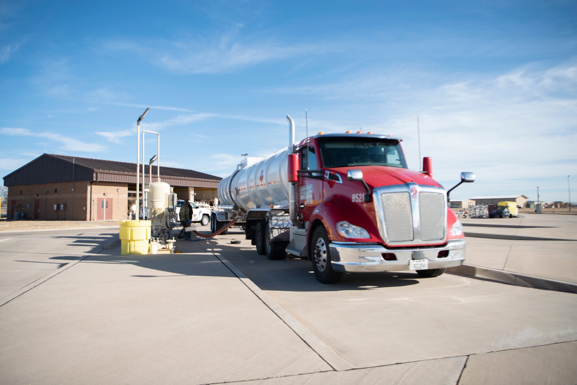 A truck sits center screen as it offloads fuel for Cannon Air Force Base