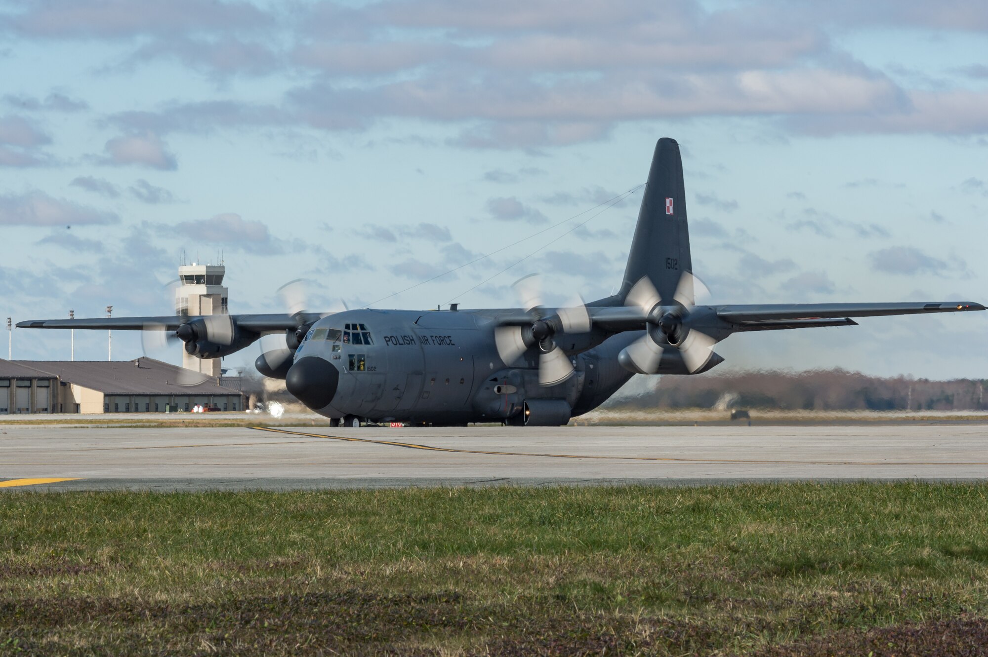 As part of a foreign military sales mission, a Polish air force C-130E Hercules taxis to a parking spot after landing to be unloaded by Airmen from the 436th Aerial Port Squadron Dec. 17, 2020, at Dover Air Force Base, Delaware. The United States and Poland have enjoyed warm bilateral relations since 1989. Poland is a stalwart NATO ally, and both the U.S. and Poland remain committed to the regional security and prosperity of Europe. Due to its strategic location, Dover AFB supports approximately $3.5 billion worth of foreign military sales annually. (U.S. Air Force photo by Roland Balik)