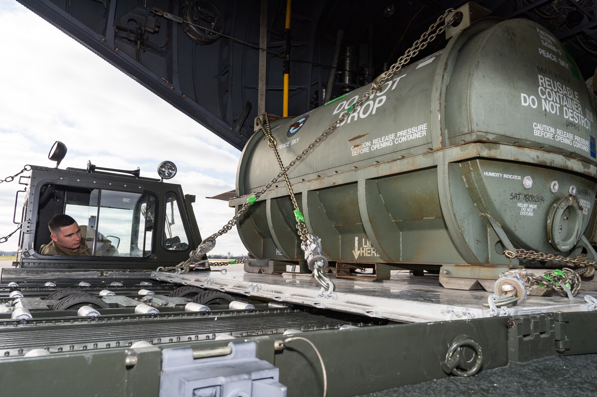 An Airmen from 436th Aerial Port Squadron loads a pallet onto a cargo loader from a Polish air force C-130E Hercules Dec. 17, 2020, at Dover Air Force Base, Delaware, as part of a foreign military sales mission. The United States and Poland have enjoyed warm bilateral relations since 1989. Poland is a stalwart NATO ally, with which the U.S. partners closely on NATO capabilities, counterterrorism, nonproliferation, missile defense and regional cooperation in Central and Eastern Europe. Due to its strategic location, Dover AFB supports approximately $3.5 billion worth of foreign military sales annually. (U.S. Air Force photo by Roland Balik)