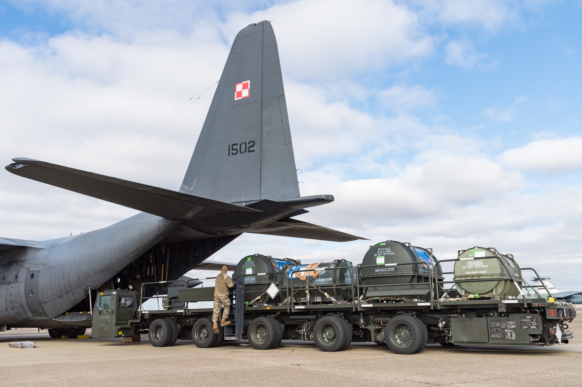 Airmen from 436th Aerial Port Squadron secure pallets on a cargo loader after unloading a Polish air force C-130E Hercules Dec. 17, 2020, at Dover Air Force Base, Delaware, as part of a foreign military sales project. The United States and Poland have enjoyed warm bilateral relations since 1989. Poland is a stalwart NATO ally, with which the U.S. partners closely on NATO capabilities, counterterrorism, nonproliferation, missile defense and regional cooperation in Central and Eastern Europe. Due to its strategic location, Dover AFB supports approximately $3.5 billion worth of foreign military sales annually. (U.S. Air Force photo by Roland Balik)