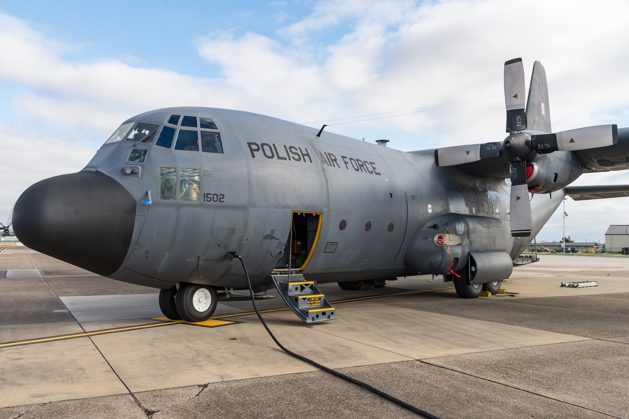 A Polish air force C-130E Hercules is parked on the flight line after delivering cargo Dec. 17, 2020, at Dover Air Force Base, Delaware, as part of a foreign military sales mission. The United States and Poland have enjoyed warm bilateral relations since 1989. Poland is a stalwart NATO ally, and both the U.S. and Poland remain committed to the regional security and prosperity of Europe. Due to its strategic location, Dover AFB supports approximately $3.5 billion worth of foreign military sales annually.  (U.S. Air Force photo by Roland Balik)