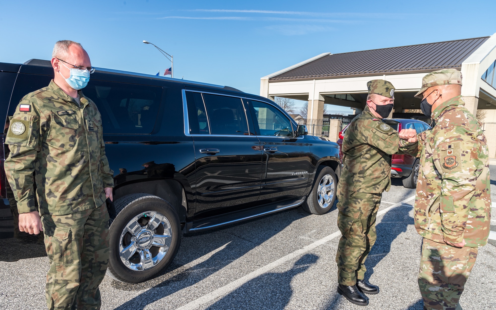 U.S. Air Force Lt. Col. James Wall, 436th Maintenance Group deputy commander greets Polish air force Col. Pawel Marzeda, deputy defense and air attache, and Polish air force Lt. Col. Karol Budniak, deputy defense and military attache, Dec. 18, 2020,  at Dover Air Force Base, Delaware. The United States and Poland have enjoyed warm bilateral relations since 1989. Poland is a stalwart NATO ally, with which the U.S. partners closely on NATO capabilities, counterterrorism, nonproliferation, missile defense and regional cooperation in Central and Eastern Europe. Due to its strategic location, Dover AFB supports approximately $3.5 billion worth of foreign military sales annually. (U.S. Air Force photo by Roland Balik)