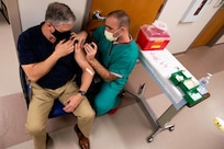 JOINT BASE LANGLEY-EUSTIS (January 11, 2021) Joint Task Force Civil Support Deputy to the Commander Casey Collins receives the COVID-19 vaccination at McDonald Army Health Center.