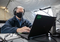 JOINT BASE LANGLEY-EUSTIS, Va. (Jan. 12, 2021) The Deputy to the Commander of Joint Task Force Civil Support Michael Collins listens to a conference call with stakeholders of the command's upcoming exercise Sudden Response 21 during a rehearsal of concept drill, Jan. 12, 2021.