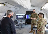 JOINT BASE LANGLEY-EUSTIS, Va. (Jan. 12, 2021) Marine Col. Timothy Powledge, the Chief of Staff assigned to Joint Task Force Civil Support (JTF-CS), talks to Army Lt. Col. Mario Oliva, the Incident Support Team leader at JTF-CS during a rehearsal of concept drill in preparation for the command's upcoming exercise Sudden Response 21, Jan. 12, 2021.