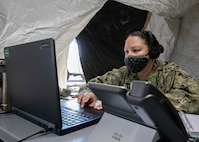 JOINT BASE LANGLEY-EUSTIS, Va. (Jan. 12, 2021) Navy Lt. Cmdr. Dominick Stelly, a member of the Incident Support Team assigned to Joint Task Force Civil Support participates in a conference call during a rehearsal of concept drill in preparation for the command's upcoming exercise Sudden Response 21, Jan. 12, 2021.