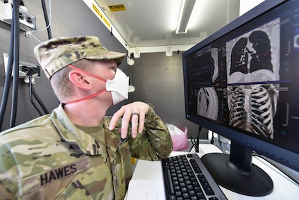 Sgt. Michael Hawes, a 68P radiology specialist assigned to Madigan Army Medical Center at Joint Base Lewis-McChord, Washington, reviews 3D images from the new deployable CT scanner. Such detailed images are an upgrade to current systems, providing Army medical personnel better tools to treat patients in the field.