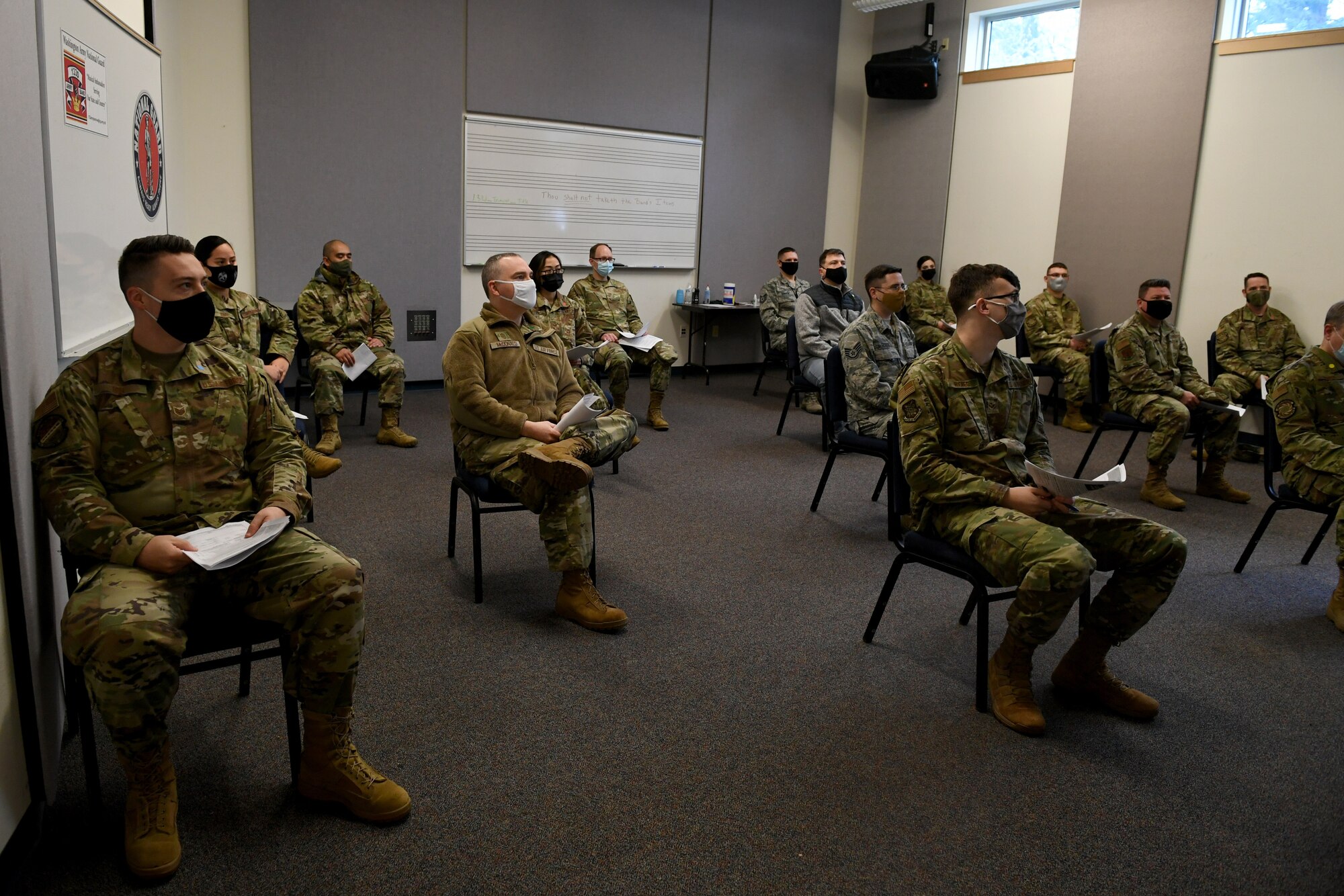 Airmen receive a briefing on the COVID-19 vaccine