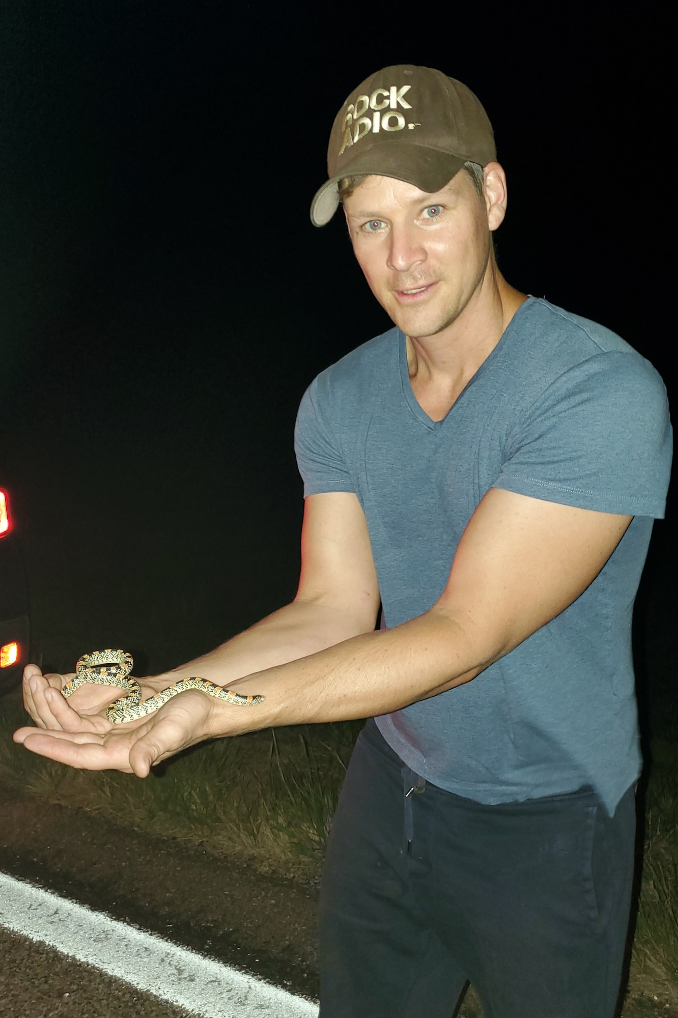 Man holding snake.