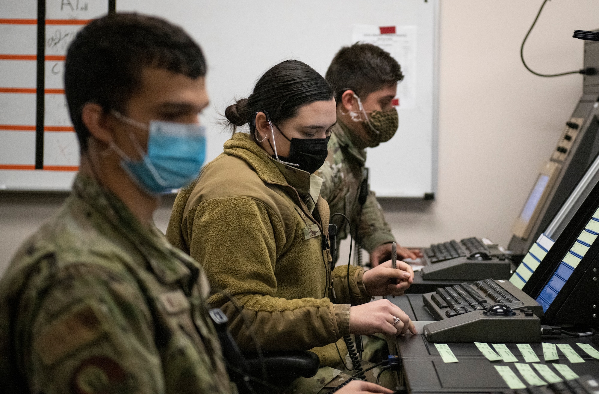 From left, Airman 1st Class Ashtan Howell, 97th Operations Support Squadron Radar Approach Control (RAPCON) air traffic controller, Airman 1st Class Linsey Beebe, 97th OSS RAPCON air traffic control apprentice, and 2nd Lt. Jorge Vazquez, 97th OSS RAPCON airfield operations trainee, view airspace radar display screens during training at Altus Air Force Base, Oklahoma, Jan. 11, 2020. Beebe and Vazquez are in the process of completing their year-long training to become certified air traffic controllers. (U.S. Air Force photo by Senior Airman Breanna Klemm)