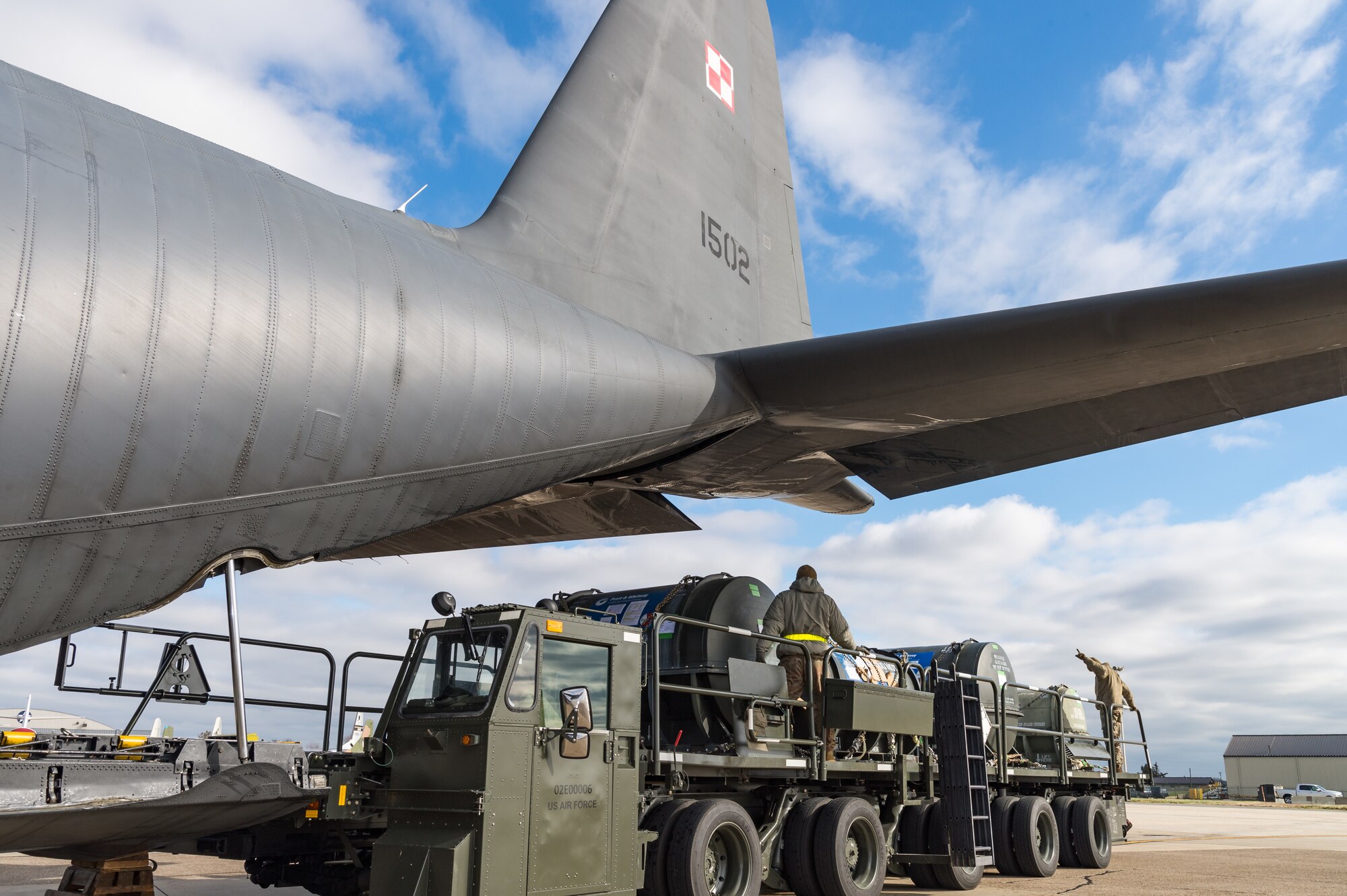 Airmen from 436th Aerial Port Squadron secure pallets on a cargo loader after unloading a Polish air force C-130E Hercules Dec. 17, 2020, at Dover Air Force Base, Delaware, as part of a foreign military sales mission. The United States and Poland have enjoyed warm bilateral relations since 1989. Poland is a stalwart NATO ally, and both the U.S. and Poland remain committed to the regional security and prosperity of Europe. Due to its strategic location, Dover AFB supports approximately $3.5 billion worth of foreign military sales annually. (U.S. Air Force photo by Roland Balik)