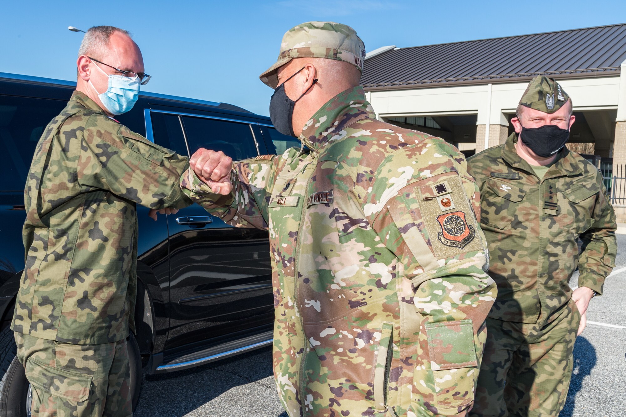 U.S. Air Force Lt. Col. James Wall, 436th Maintenance Group deputy commander greets Polish air force Lt. Col. Karol Budniak, deputy defense and military attache, and Polish air force Col. Pawel Marzeda, deputy defense and air attache,  Dec. 18, 2020,  at Dover Air Force Base, Delaware. The United States and Poland have enjoyed warm bilateral relations since 1989. Poland is a stalwart NATO ally, and both the U.S. and Poland remain committed to the regional security and prosperity of Europe. Due to its strategic location, Dover AFB supports approximately $3.5 billion worth of foreign military sales annually. (U.S. Air Force photo by Roland Balik)