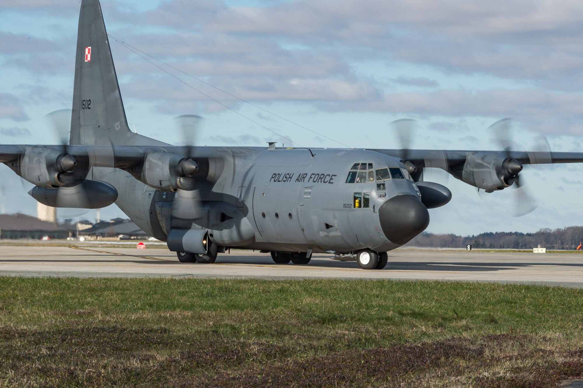As part of a foreign military sales mission, a Polish air force C-130E Hercules taxis to a parking spot after landing to be unloaded by Airmen from the 436th Aerial Port Squadron Dec. 17, 2020, at Dover Air Force Base, Delaware. The United States and Poland have enjoyed warm bilateral relations since 1989. Poland is a stalwart NATO ally, with which the U.S. partners closely on NATO capabilities, counterterrorism, nonproliferation, missile defense and regional cooperation in Central and Eastern Europe. Due to its strategic location, Dover AFB supports approximately $3.5 billion worth of foreign military sales annually. (U.S. Air Force photo by Roland Balik)