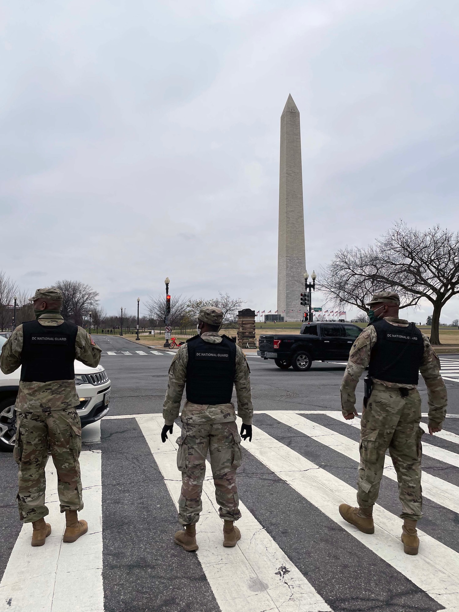 DC National Guard members stand in front of a monument in Washington, D.C on January 5, 2021. The District of Columbia National Guard activated several hundred personnel to support the city government during expected demonstrations. (D.C. National Guard photo by Staff Sgt. Anthony Small)