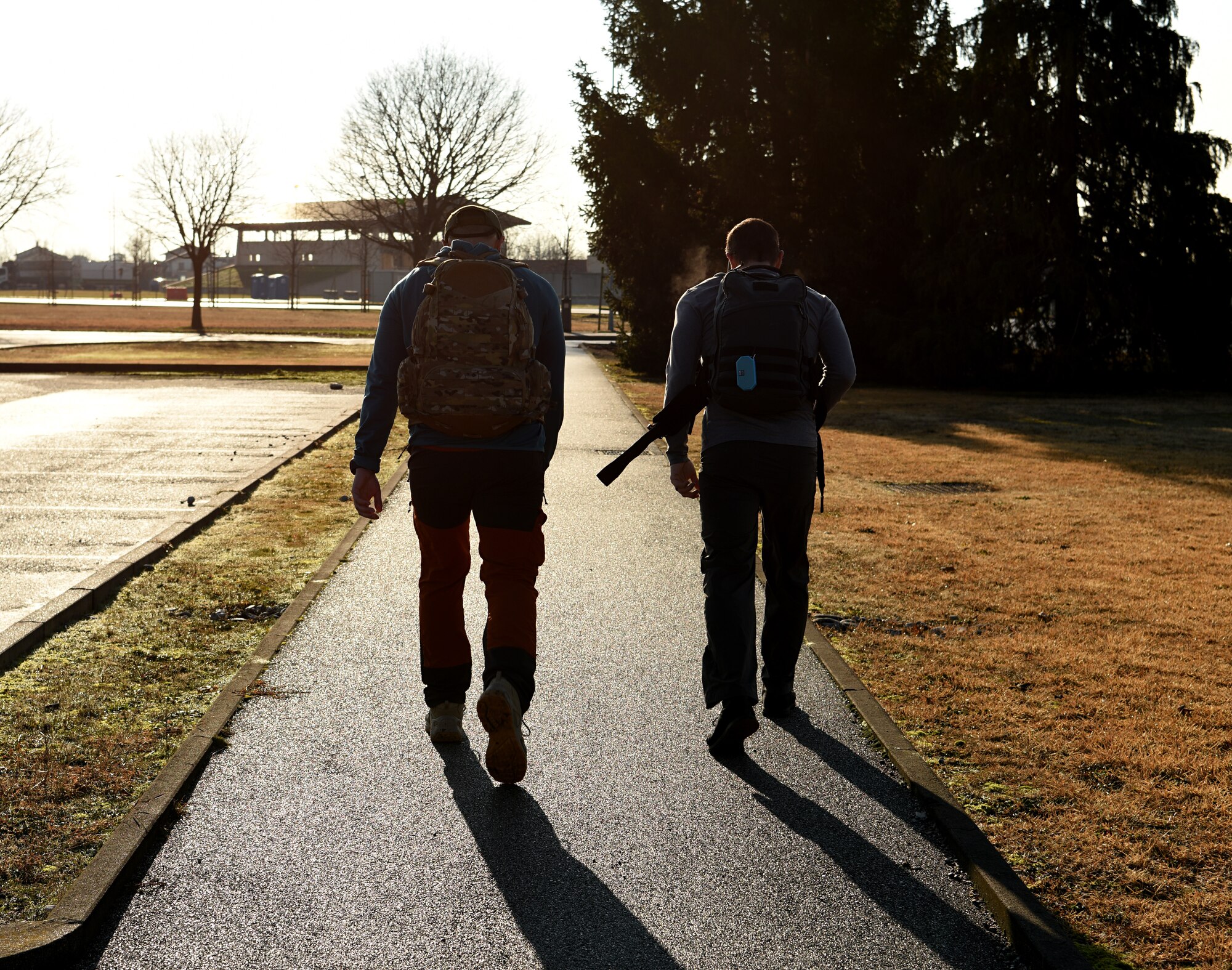 U.S. Air Force Lt. Col Bryan Ballestero, 56th Rescue Squadron assistant director of operations, right, and 1st Lt. Cody Page, 56th RQS HH-60G Pave Hawk rescue pilot, left,  participate in a ruck in memory of the fallen Jolly 22 crew at Aviano Air Base, Italy, Jan. 7, 2021.