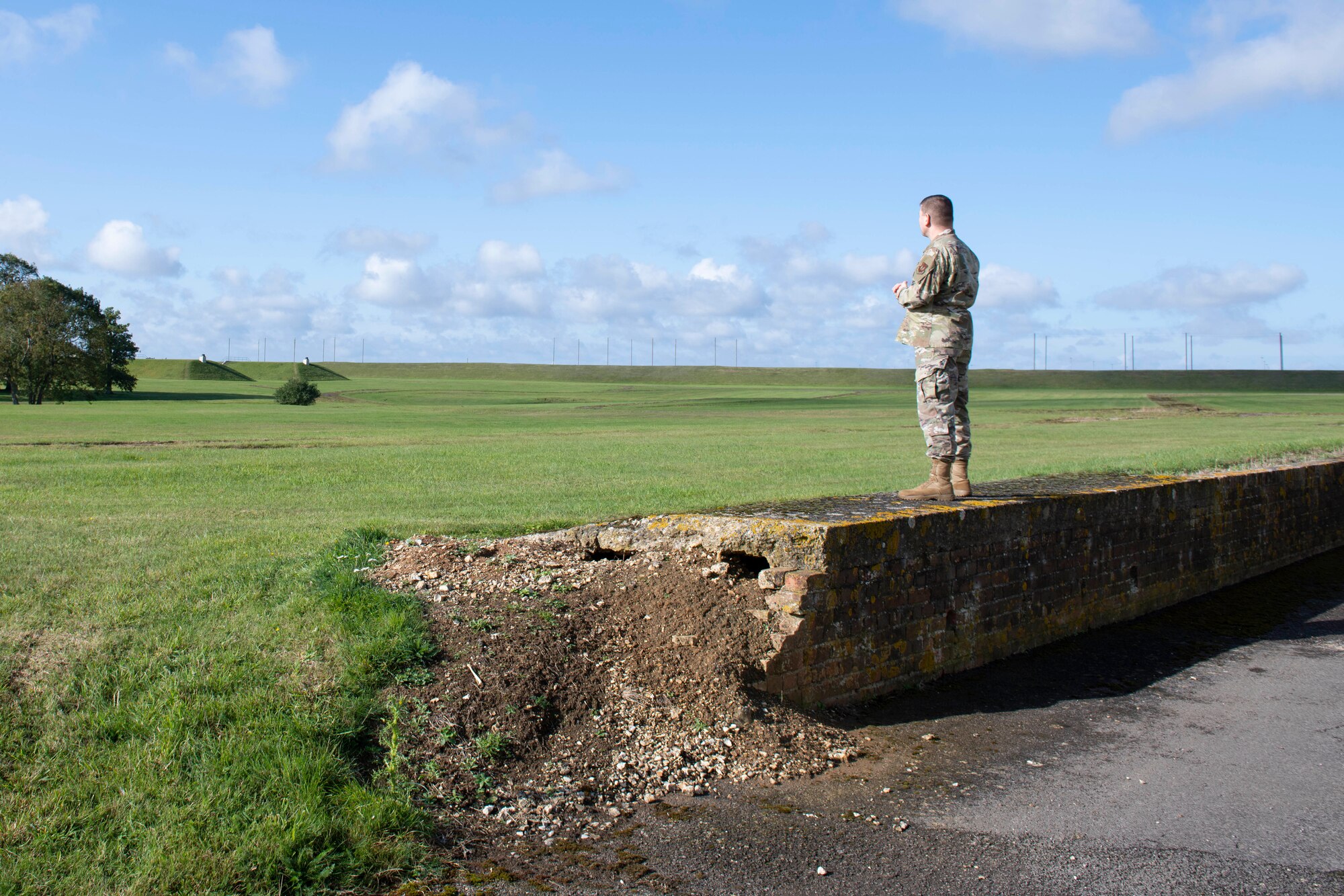 U.S. Air Force Col. Kurt Wendt, 501st Combat Support Wing commander, stands on the location where Gen. Dwight D. Eisenhower and Winston Churchill stood on June 5, 1944, before the 101st Airborne Division at the RAF Welford Park airfield, before taking off for Normandy in support of D Day. Wendt visited 420th MUNS to meet with the Airmen and to learn more about their new mission capabilities. (U.S. Air Force photo by Senior Airman Jennifer Zima)