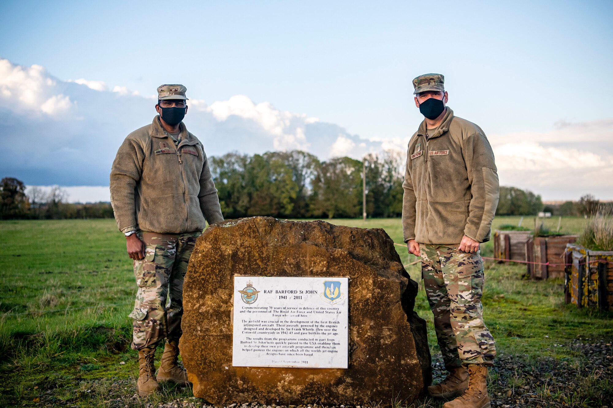 U.S. Air Force Maj. Gen. Randall Reed (left), Third Air Force commander and Chief Master Sgt. Randy Kwiatkowski (right), poses for a photo next to a monument at Royal Air Force Barford St. John, England, Oct. 27, 2020. The Third Air Force command team visited RAF Barford St. John to speak with and recognize the 422nd CS Airmen as well as visit the base’s monuments to pay homage to the installation’s rich history. (U.S. Air Force photo by Senior Airman Eugene Oliver)